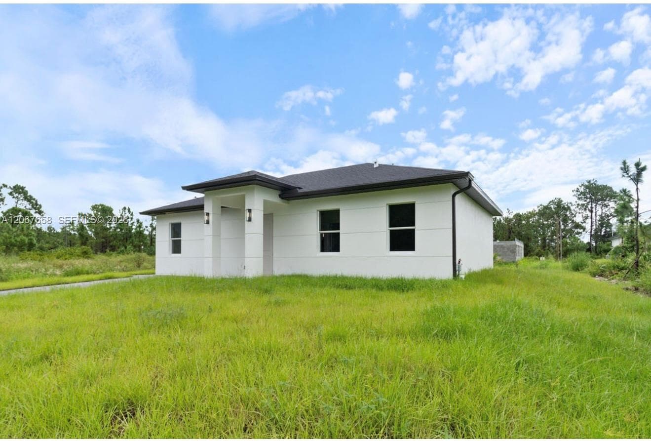 710 Peacock Ave, Lehigh Acres FL 33974 photo 3